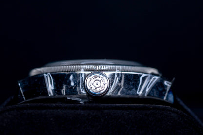 Tudor Black Bay GMT Pepsi watch side view with polished case and winding crown detail.