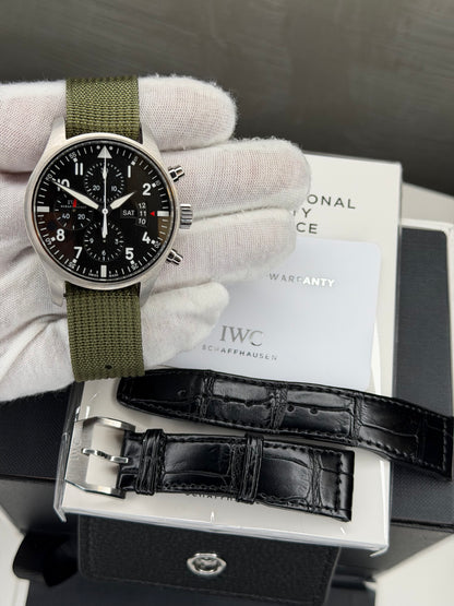 IWC Pilot's Watch Chronograph 43mm with green strap and black dial, includes warranty card and additional leather strap.