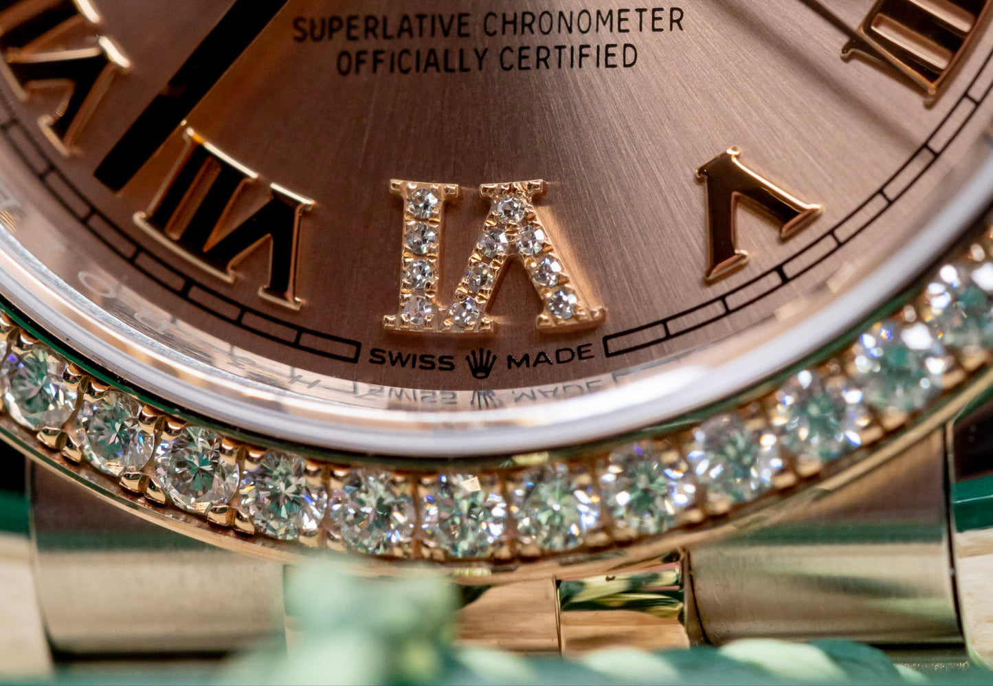 Close-up of the Rolex Datejust 36 watch with Everose gold and diamond bezel, showcasing luxury and craftsmanship.