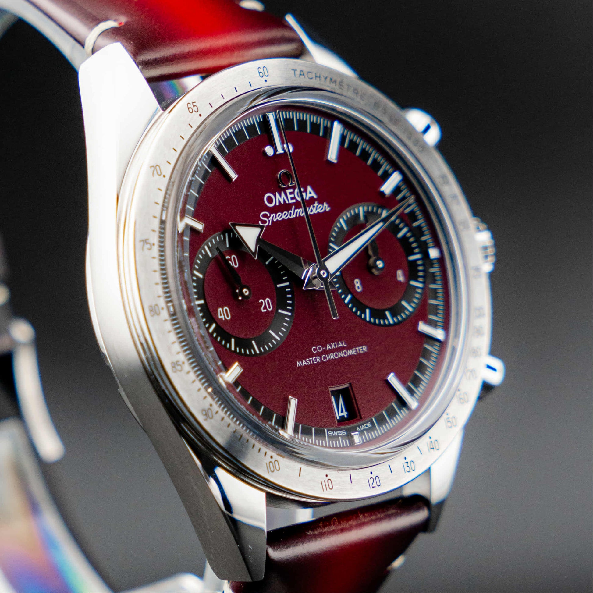 Omega Speedmaster '57 Burgundy full set with a deep burgundy dial and vintage-inspired broad arrow hands.
