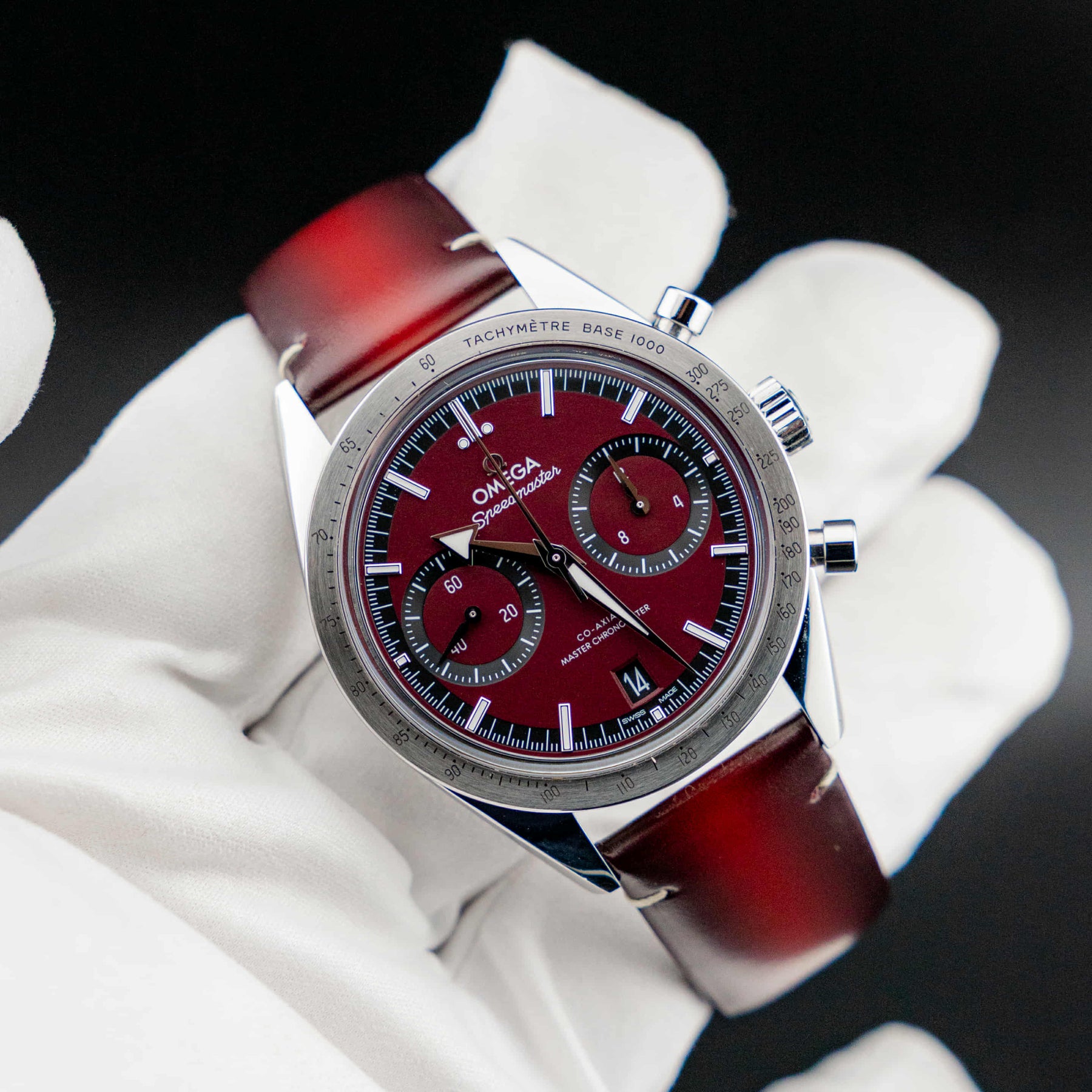 Omega Speedmaster '57 Burgundy full set close-up with burgundy dial and chronograph features
