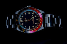 Tudor Black Bay 58 GMT watch with blue dial, stainless steel bracelet, and colorful bezel.