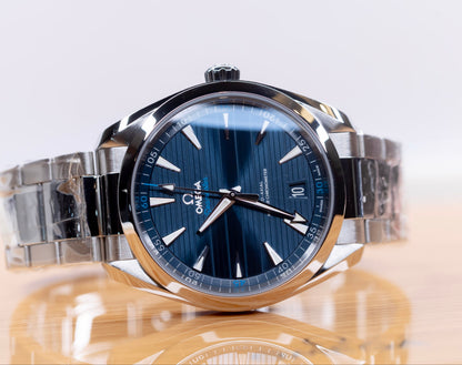 Omega Seamaster Aqua Terra 41mm watch with blue dial and stainless steel band on a wooden surface.