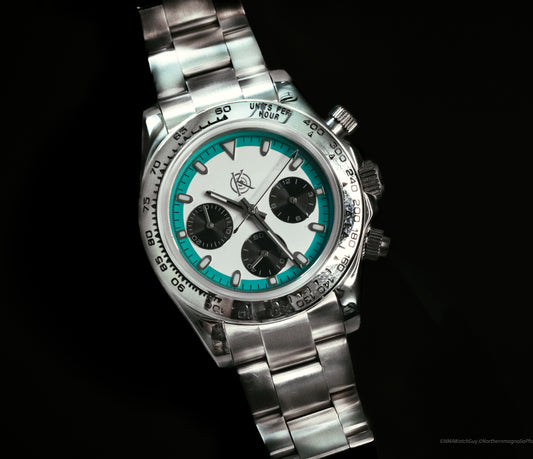 The Voyager Chronograph from Kingdom Watch Company featuring a silver case and turquoise accents for adventurers.