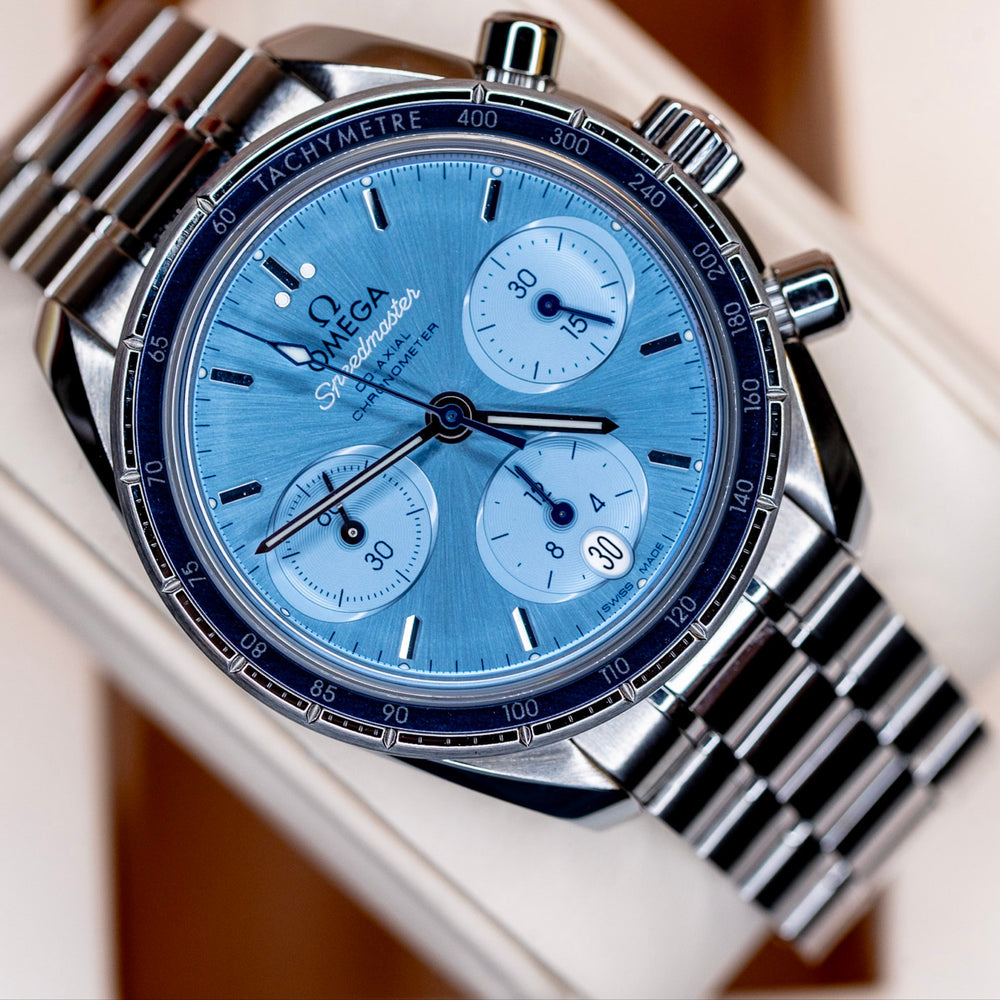 Omega Speedmaster Chronograph 38 review featuring a blue dial and stainless steel case and bracelet.