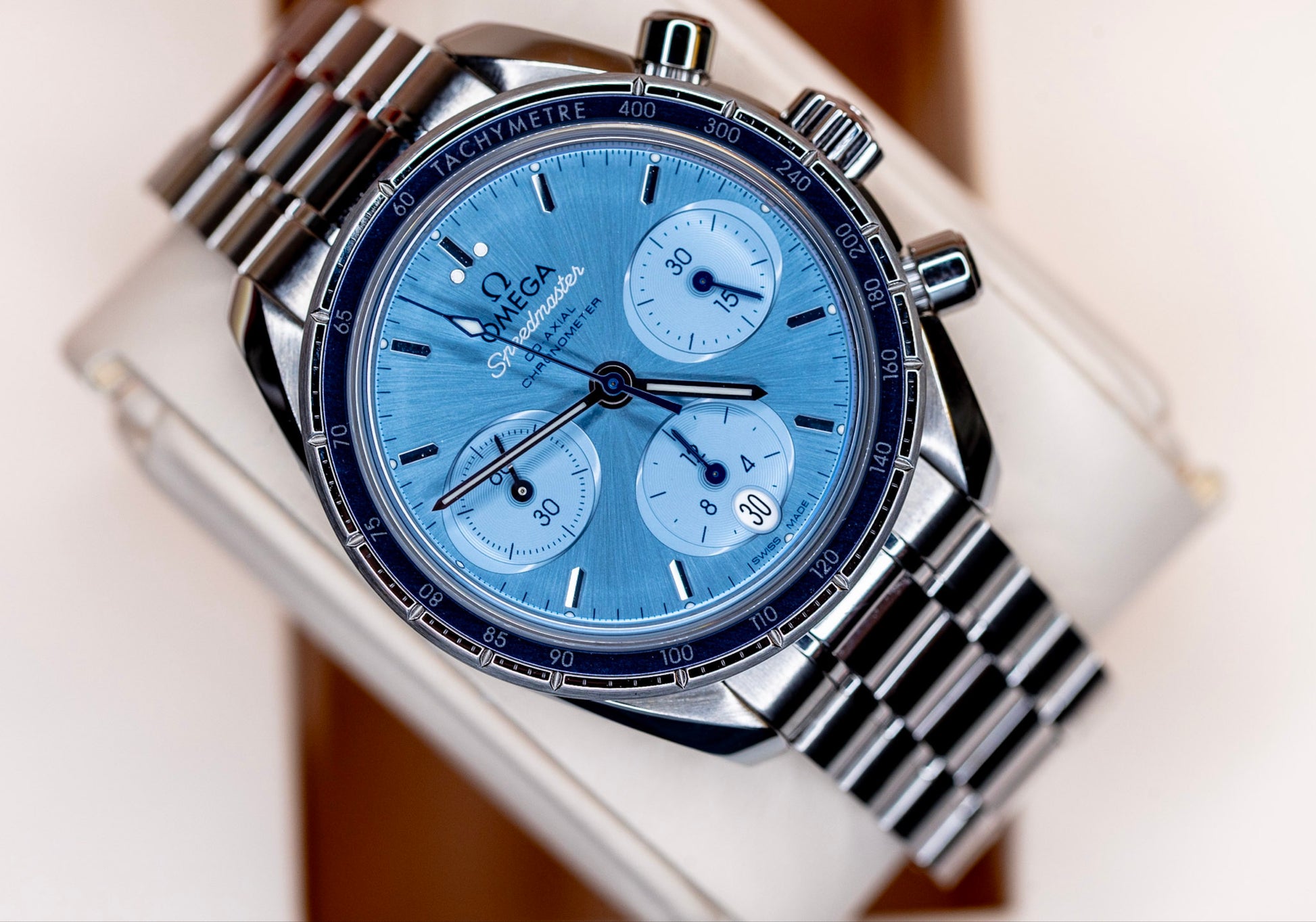 Omega Speedmaster Chronograph 38 review featuring a blue dial and stainless steel case and bracelet.