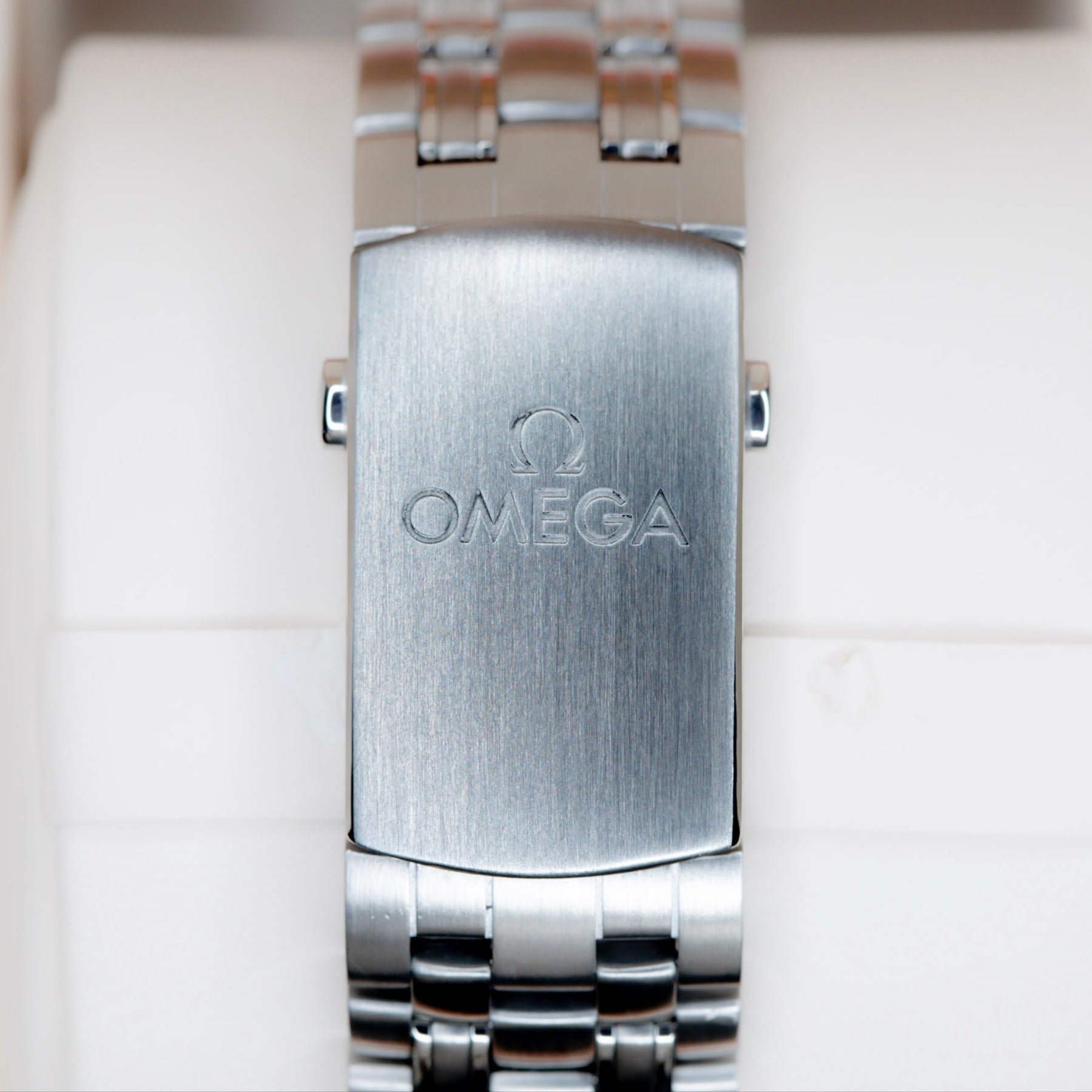 2018 Omega Seamaster Diver watch with a stainless steel bracelet and engraved Omega logo on the clasp.