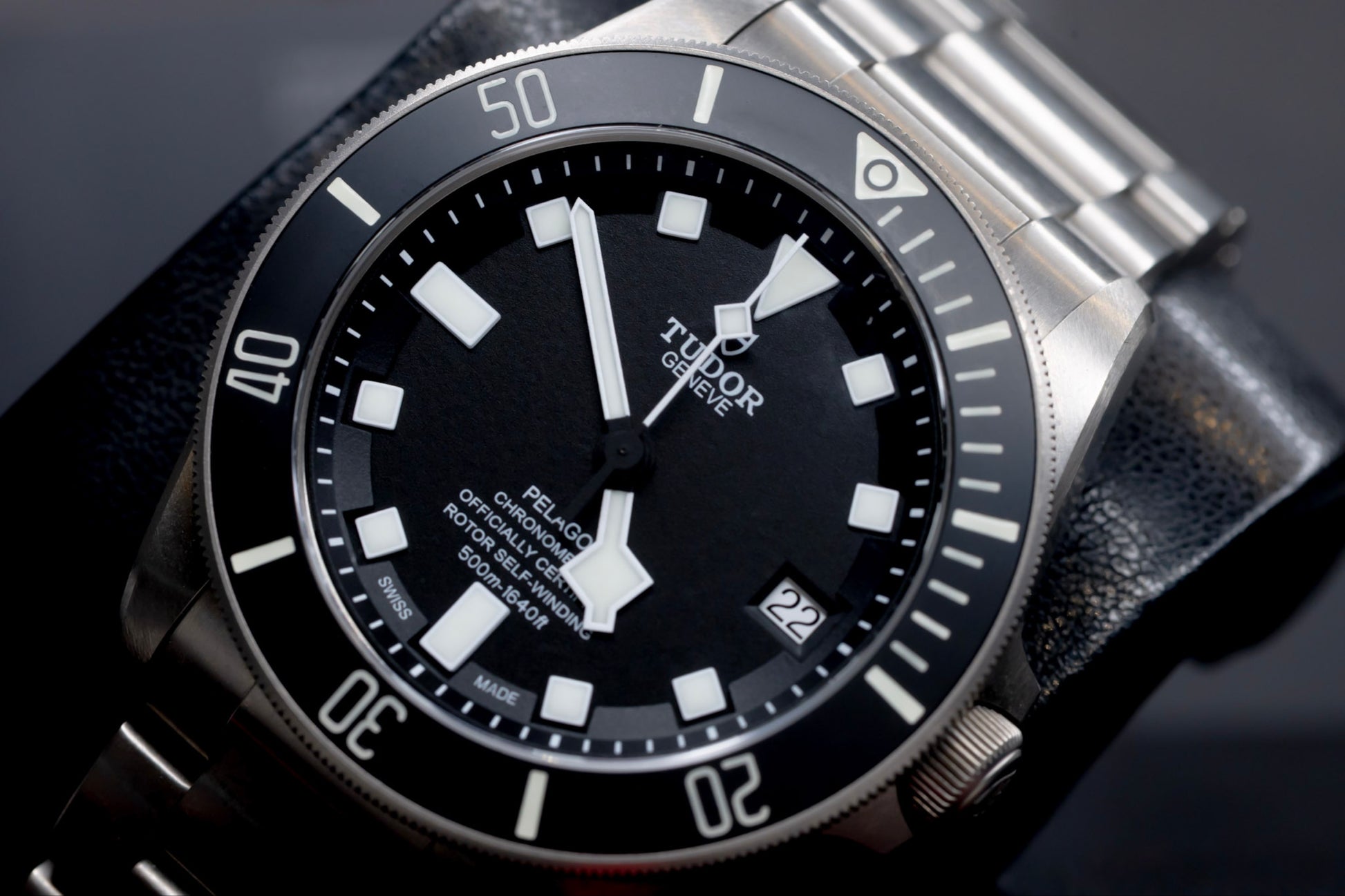 Tudor Pelagos dive watch with black dial and titanium case, showcasing iconic snowflake hands and square markers.