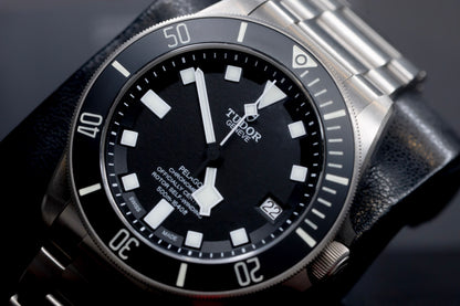 Tudor Pelagos dive watch with black dial and titanium case, showcasing iconic snowflake hands and square markers.