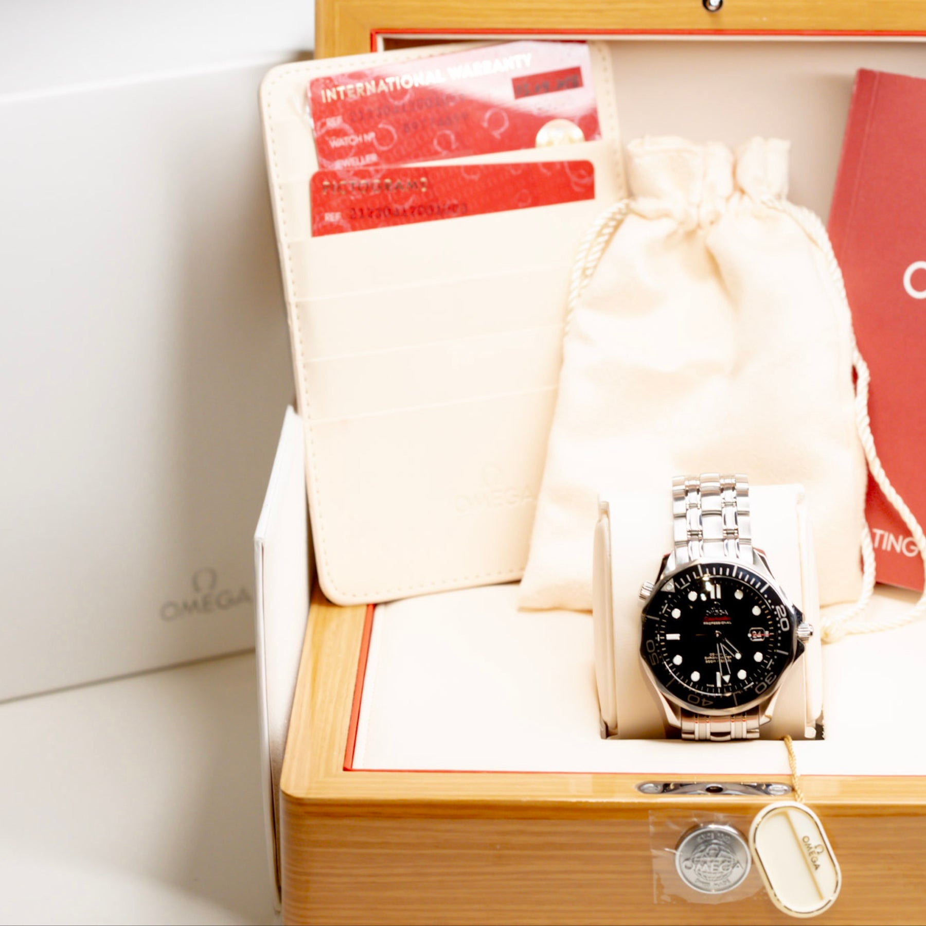 2018 Omega Seamaster Diver watch in original box with papers, warranty, and instructions.