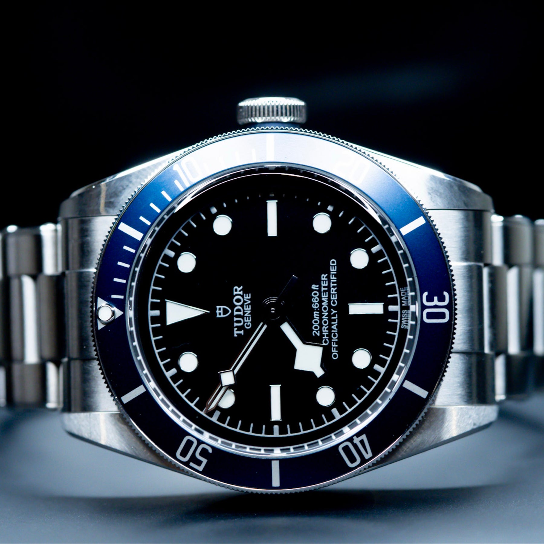 Tudor Black Bay Heritage 79230B watch with a blue bezel and black dial, showcasing a vintage nautical design.