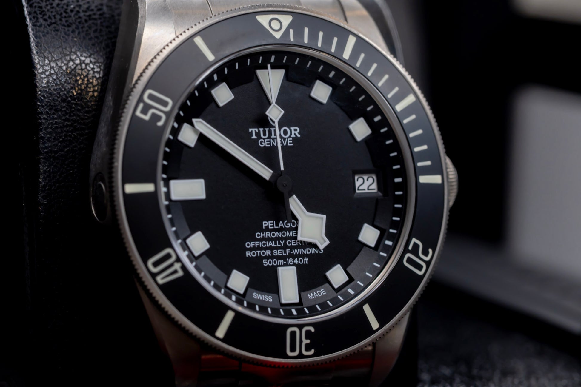 Close-up of Tudor Pelagos dive watch showcasing its titanium case, snowflake hands, and bold markers.