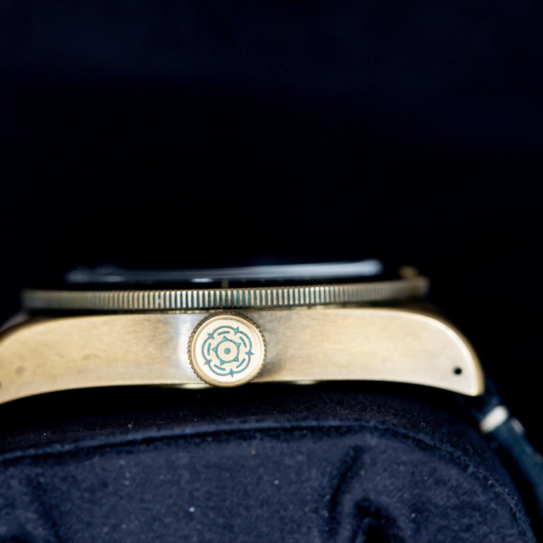 Side view of the 2022 Tudor Black Bay Bronze watch, showcasing its bronze case and signature crown detail.