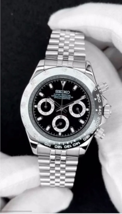 Black and silver chronograph daytona