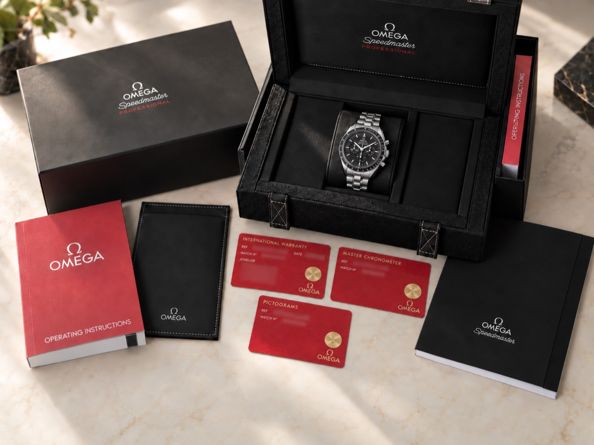 A complete set laid out: box, warranty card and manuals